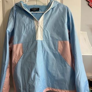 Hooded jacket. Rain jacket material but can be worn as a normal jacket.
